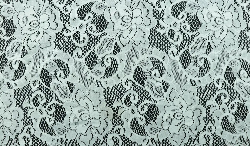 Close-up of floral lace showing fine mesh and openwork detail